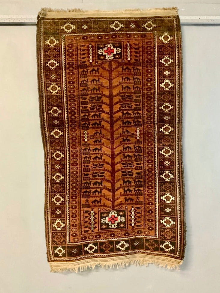 Balouch rug with a camel train (193 x 112cm)