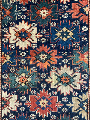 Caucasian antique Shirvan blossom type long rug (292 x 108cm)