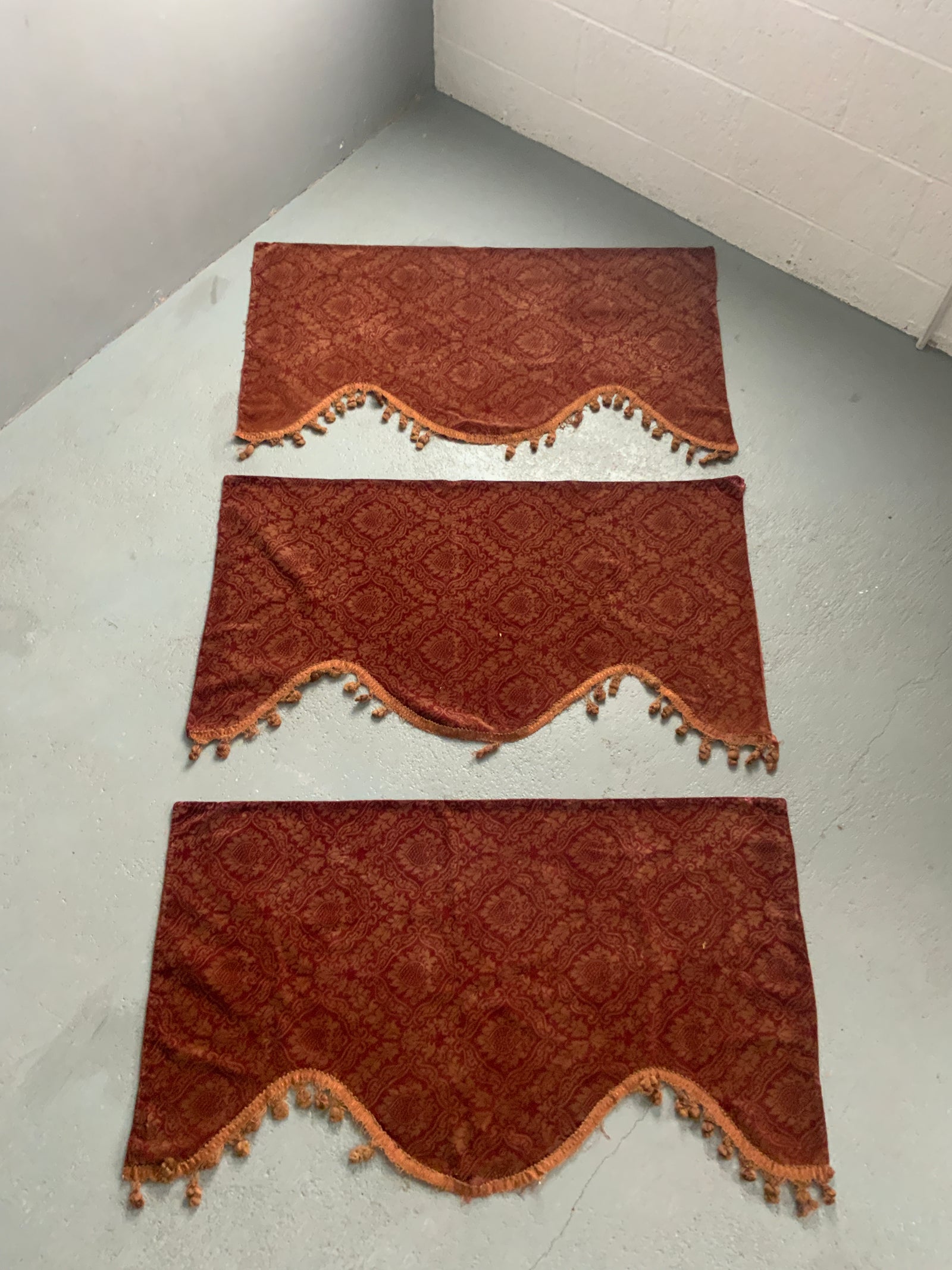 3 x Victorian printed and etched red ochre velvet pelmets (~111 x 63cm)