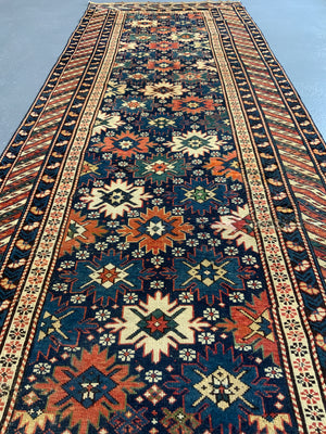 Caucasian antique Shirvan blossom type long rug (292 x 108cm)
