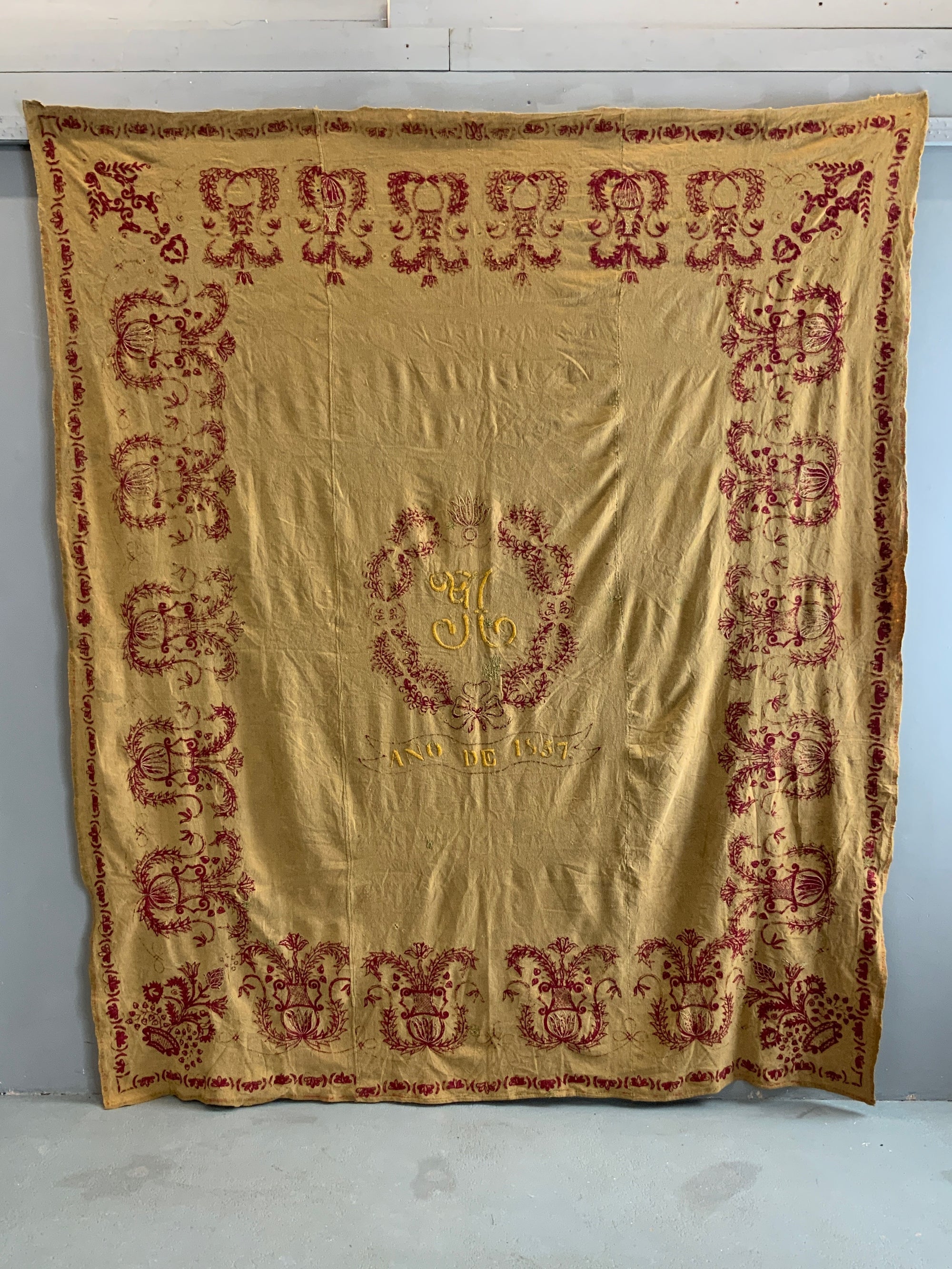 Monogrammed antique yellow wool embroidered coverlet (234 x 204cm)