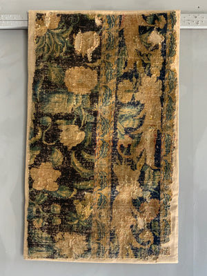 A Louis XIV Savonnerie carpet fragment (105 x 64cm)
