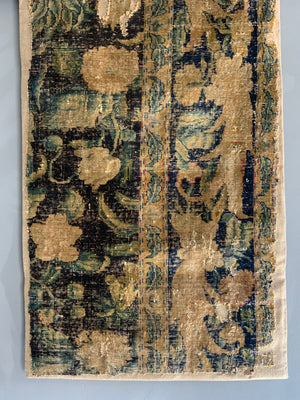 A Louis XIV Savonnerie carpet fragment (105 x 64cm)