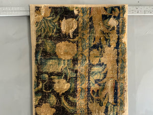 A Louis XIV Savonnerie carpet fragment (105 x 64cm)