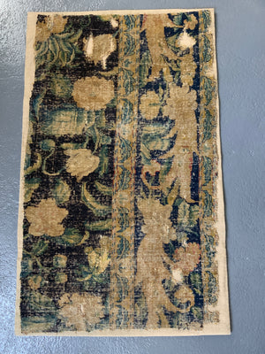 A Louis XIV Savonnerie carpet fragment (105 x 64cm)