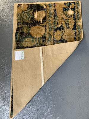 A Louis XIV Savonnerie carpet fragment (105 x 64cm)