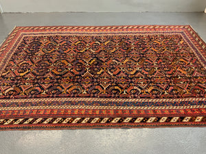 Afshar antique rug with all over design (243 x 162cm)