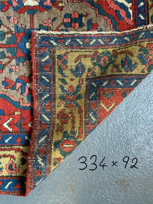 NWP vintage red ground runner with five medallions (334 x 92cm)