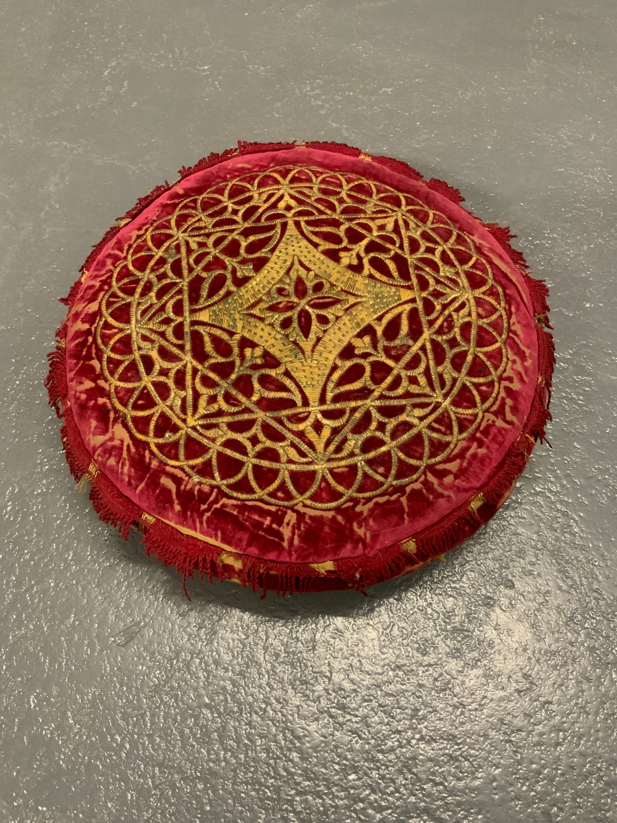 Indian velvet antique squab cushion (38cm diameter)