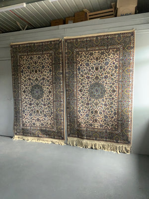 Pair of Kashan rugs with pale field (234 x 142 / 244 x 144cm)