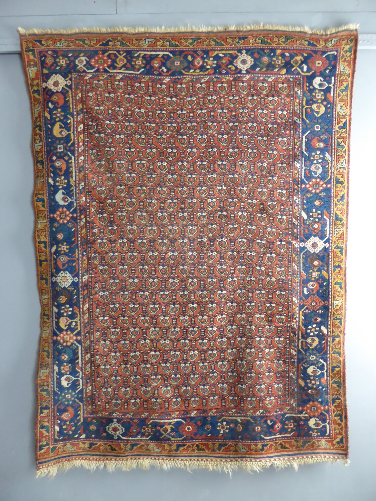Afshar antique red / orange ground rug with lattice design (191 x 146cm)