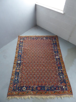 Afshar antique red / orange ground rug with lattice design (191 x 146cm)