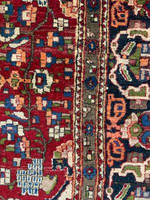 Najafabad vintage rug with medallion design on red (213 x 151cm)