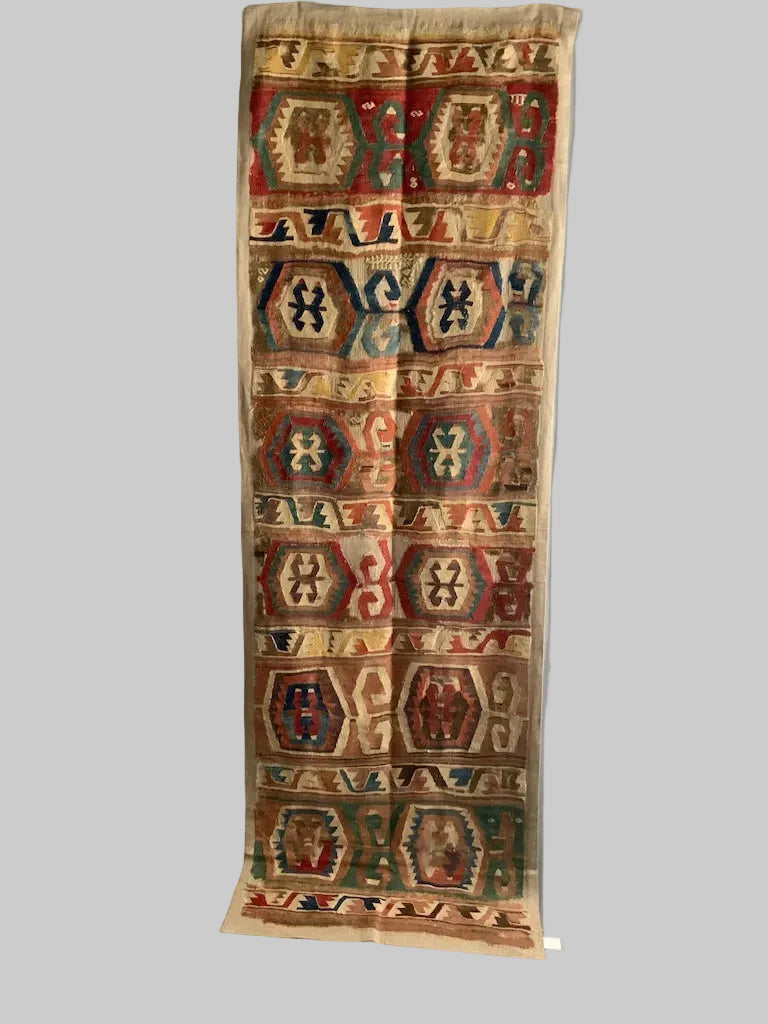 Anatolian mounted antique kilim fragment (291 x 85cm)