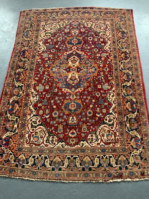 Najafabad vintage rug with medallion design on red (213 x 151cm)